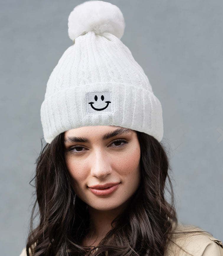 White smiley face hat